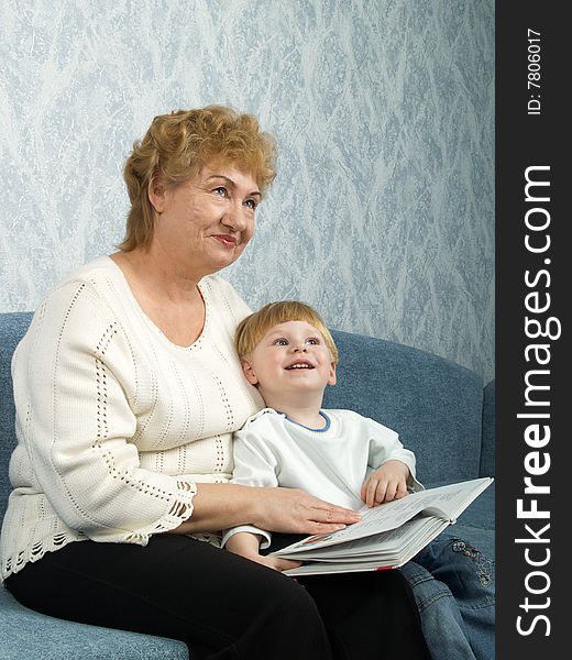 Portrait of the grandmother with the grandson in house conditions