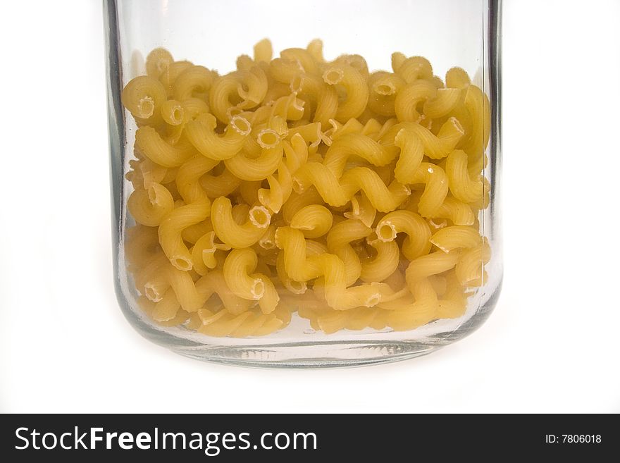 Macaroni in a jar with a white background