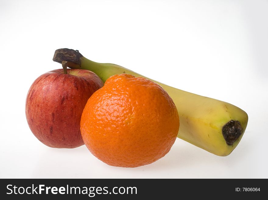 Fruit collection consisting of a banana, manderin and apple