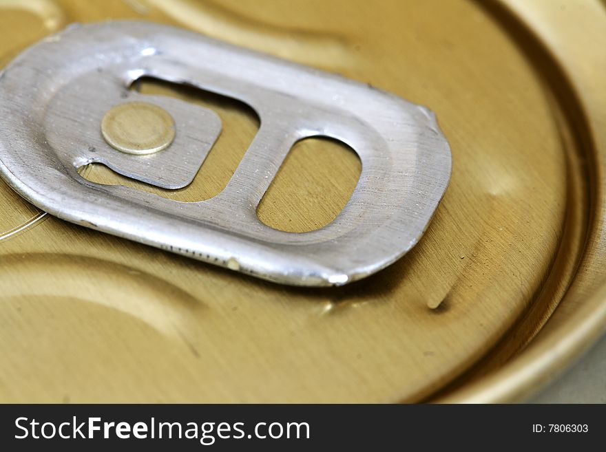 The top of a soda or beer can. The top of a soda or beer can