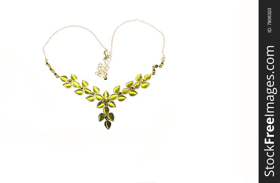 A green necklace in a heart shape on a white background. A green necklace in a heart shape on a white background