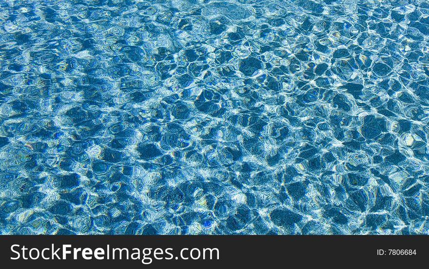 Fresh water blue background with sun ripples