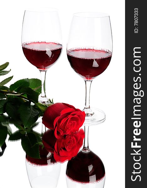Two glasses of wine and rose isolated on white. Two glasses of wine and rose isolated on white