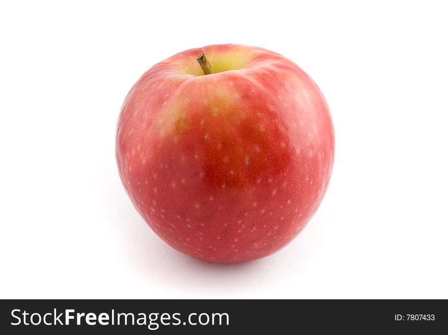 A single fresh, crisp red apple isolated on a white background