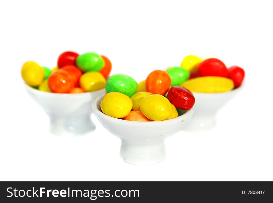 An image of multicolored candies over white