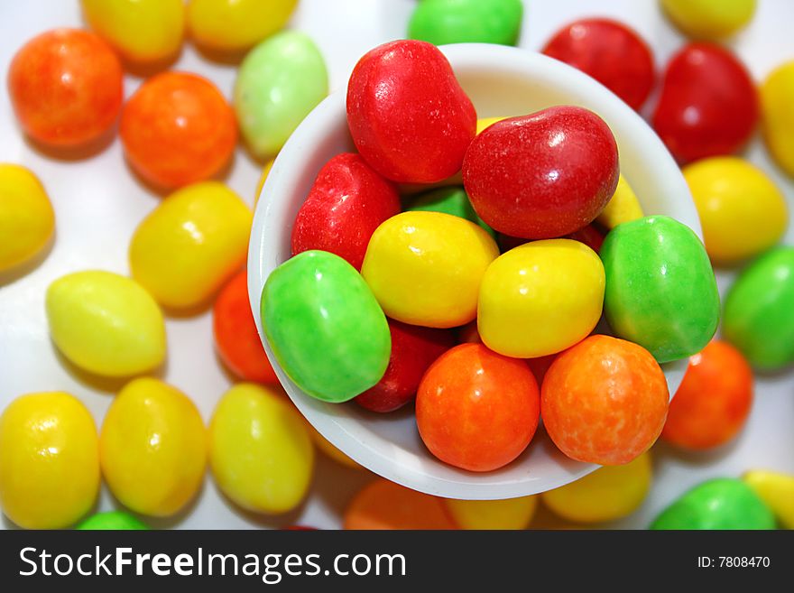 An image of multicolored candies over white