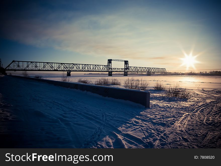 Bridge over river on sunset