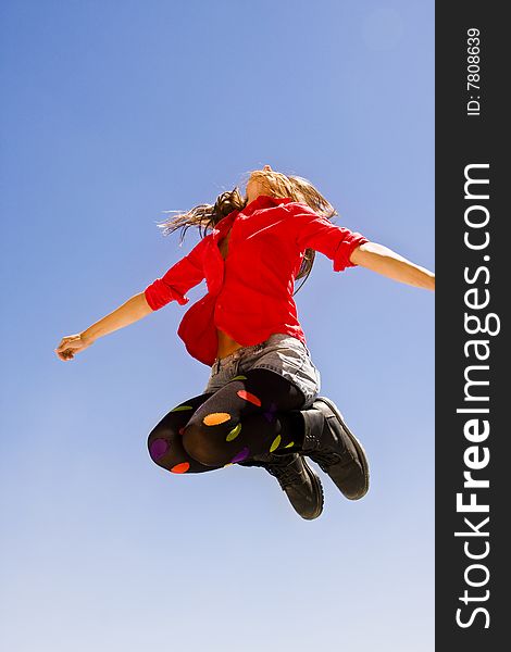 Jumping woman in funny casual clothing. Jumping woman in funny casual clothing