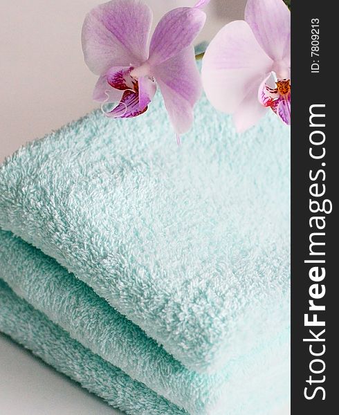 Tender towels with an orchid in close up