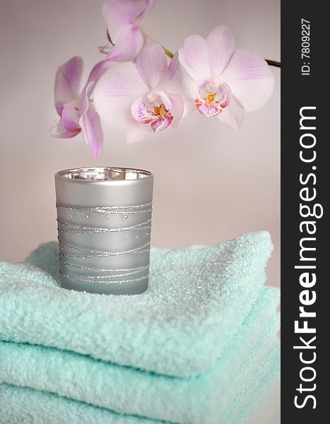 Tender towels with an orchid in close up. Tender towels with an orchid in close up
