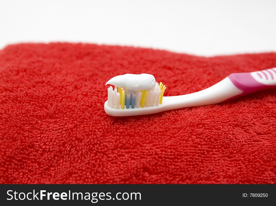 Toothbrush on a red towel