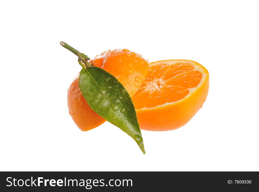 A sliced fresh juicy orange with leaf. A sliced fresh juicy orange with leaf.