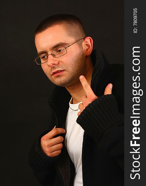 Young relaxed casual man pointing with his finger