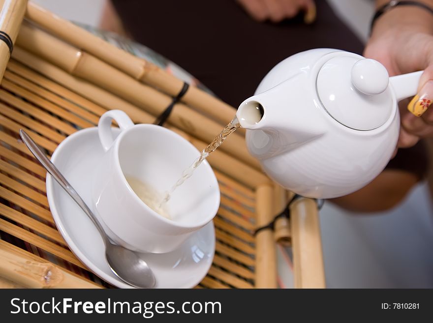 Closeup picture of tea ceremony set in action. Closeup picture of tea ceremony set in action