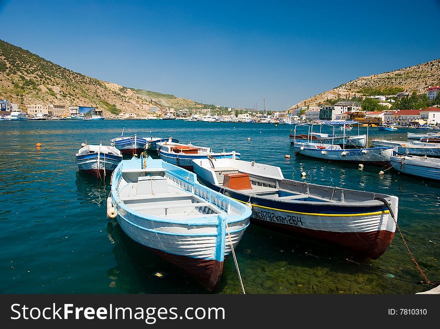 Yachts in a sea bay. Yachts in a sea bay