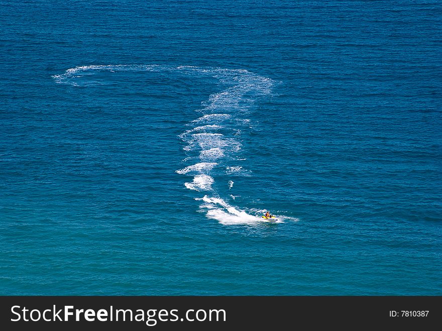 Question mark on water drawn by a jetski