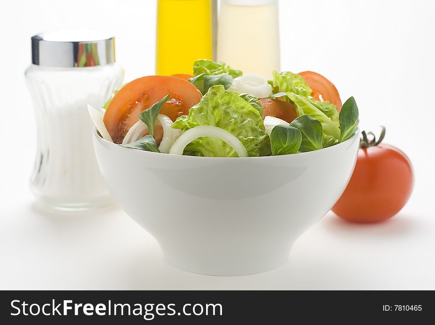 Fresh natural salad bowl tomato lettuce onion oil vinegar