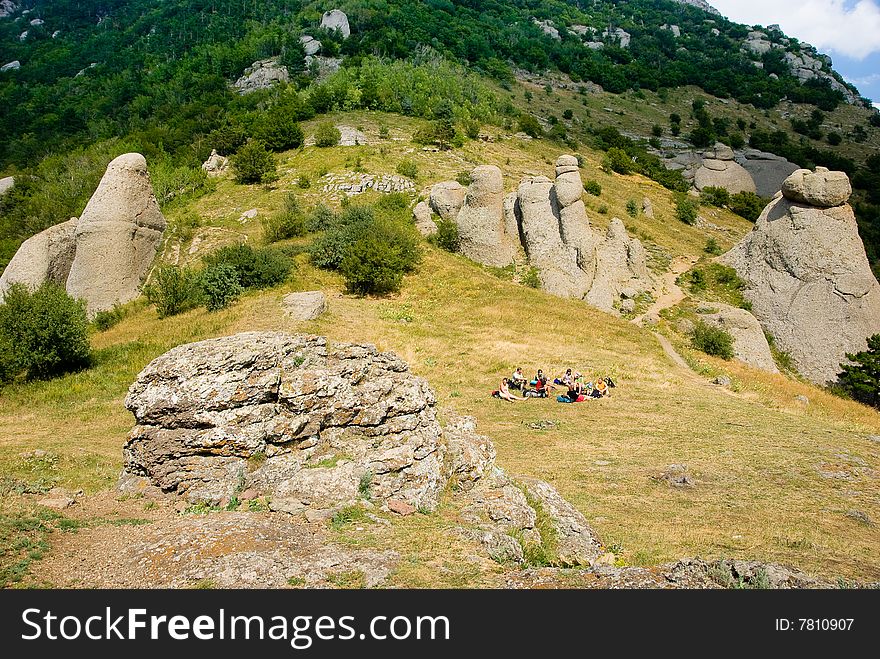 Hikers have a rest on a hillside