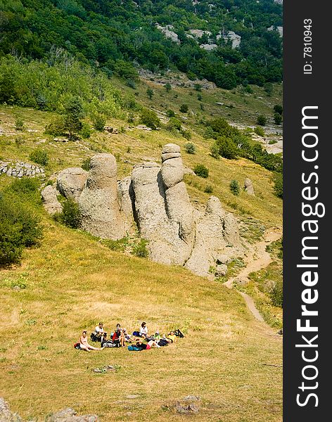 Hikers have a rest on a hillside