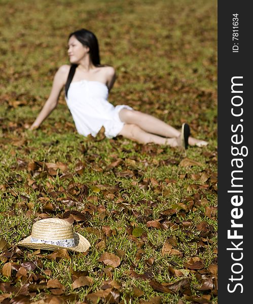 A beautiful asian girl enjoying the outdoor sun. A beautiful asian girl enjoying the outdoor sun