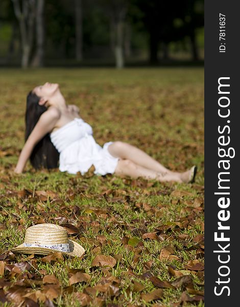 A beautiful asian girl enjoying the outdoor sun. A beautiful asian girl enjoying the outdoor sun