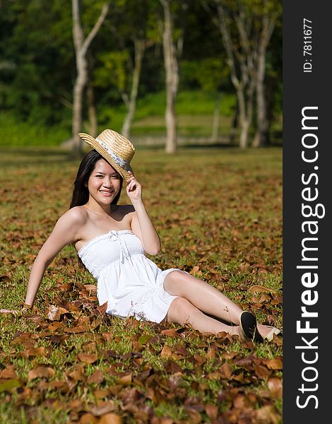 A beautiful asian girl enjoying the outdoor sun. A beautiful asian girl enjoying the outdoor sun