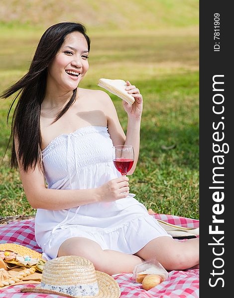 Beautiful asian girl picnic in the park