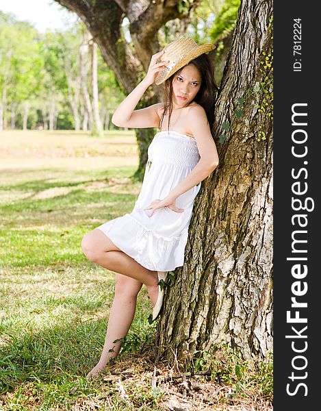 A beautiful asian girl enjoying the outdoor sun. A beautiful asian girl enjoying the outdoor sun