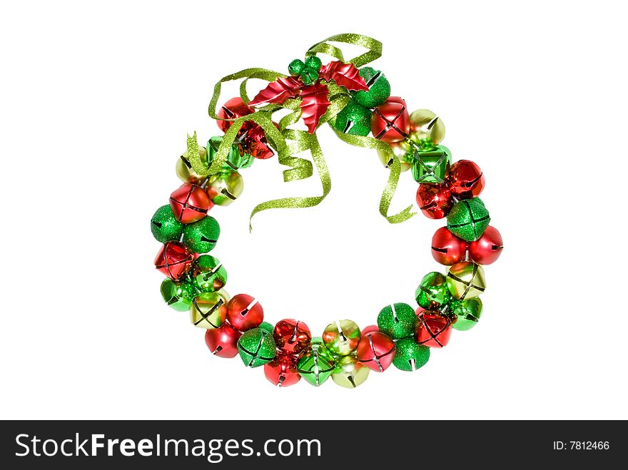 Christmas wreath with green, red and gold bells and holly leaves and berries.  Isolated on a white background. Christmas wreath with green, red and gold bells and holly leaves and berries.  Isolated on a white background.