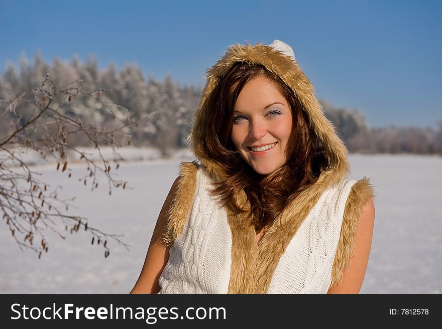 Smiling sexy woman in winter nature