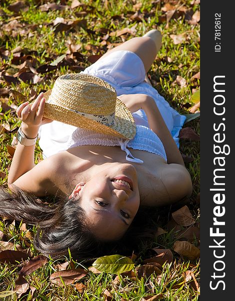 A beautiful asian girl enjoying the outdoor sun. A beautiful asian girl enjoying the outdoor sun