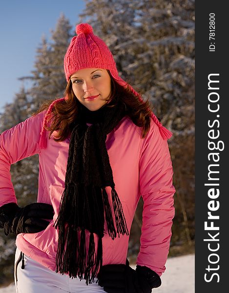 Young woman in pink on snow in winter. Young woman in pink on snow in winter