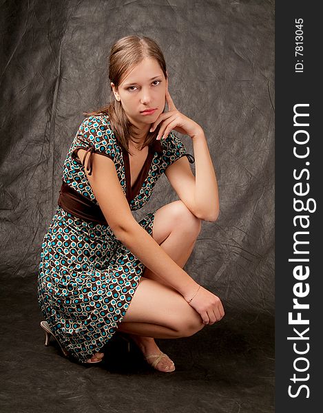 Young girl white skin sitting on black