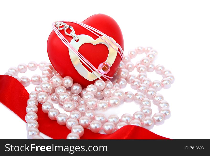 Valentine hearts,red ribbon and pink pearls on white background.