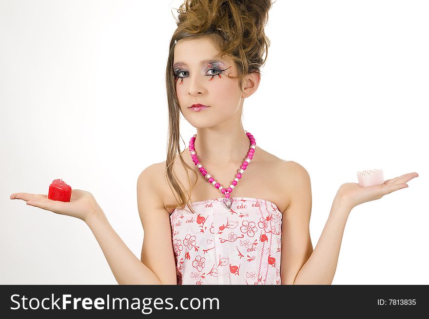 Fashion girl holding valentine's day candles in her hands. Fashion girl holding valentine's day candles in her hands