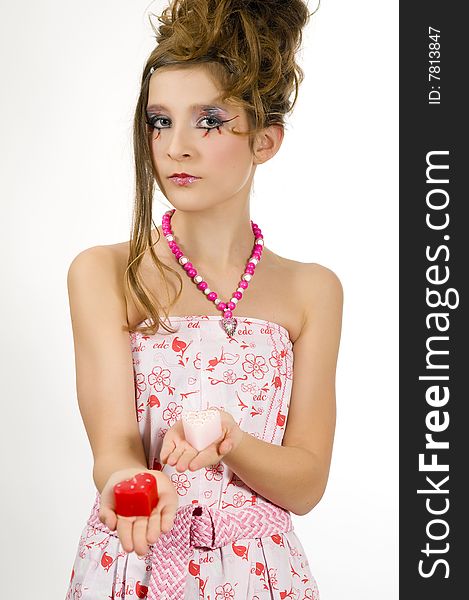 Fashion girl holding valentine's day candles in her hands. Fashion girl holding valentine's day candles in her hands
