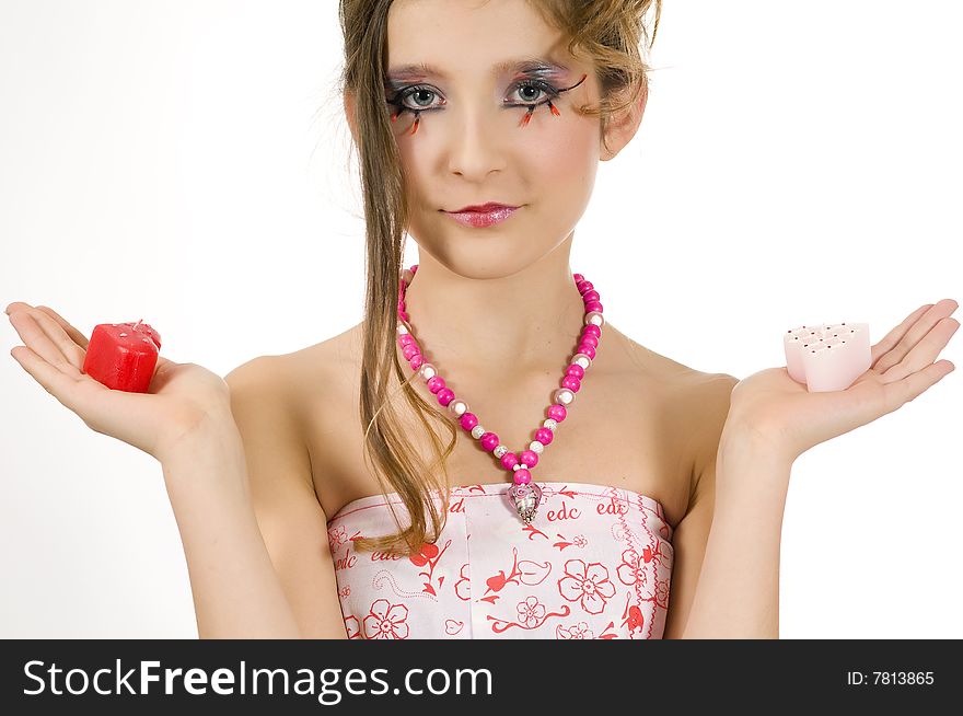 Fashion girl holding valentine's day candles in her hands. Fashion girl holding valentine's day candles in her hands