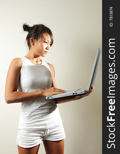 Woman Holding A Laptop