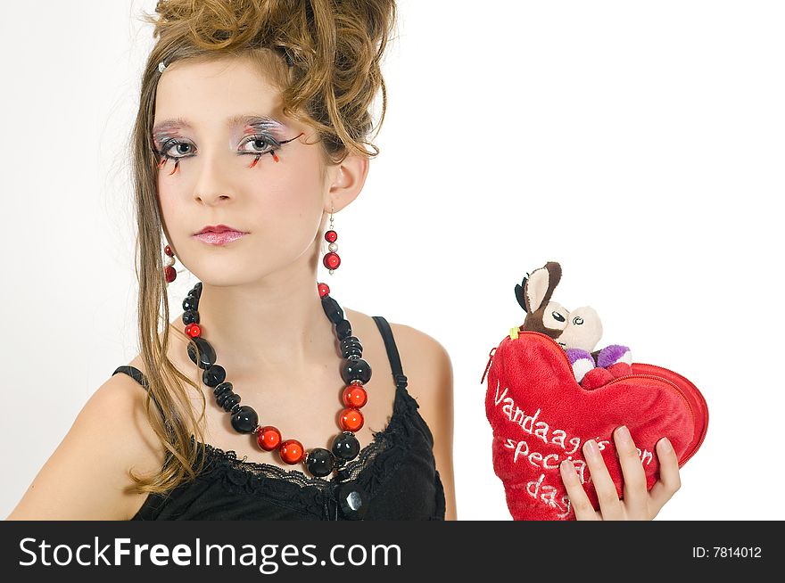 Fashion girl with black red necklace and black top holding a valentine's day present in her hand. Fashion girl with black red necklace and black top holding a valentine's day present in her hand