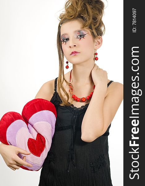 Girl holding a valentine s day pillow