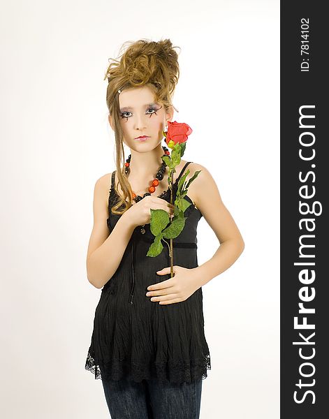 Fashion girl with black red necklace and black top holding a valentine's day red rose in her hand. Fashion girl with black red necklace and black top holding a valentine's day red rose in her hand