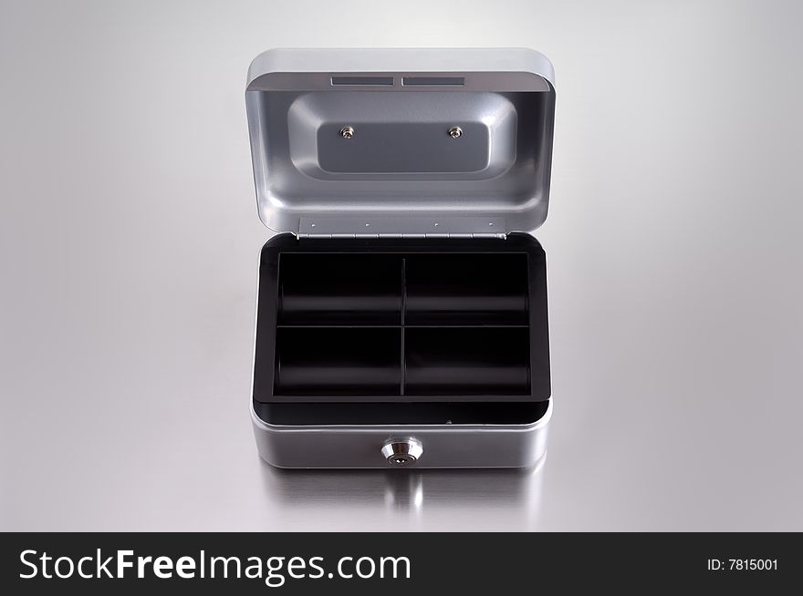 Opend cash box on metalic background. Opend cash box on metalic background