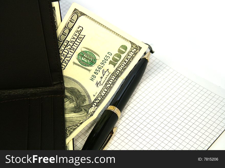 Notepad with pen and purse with money