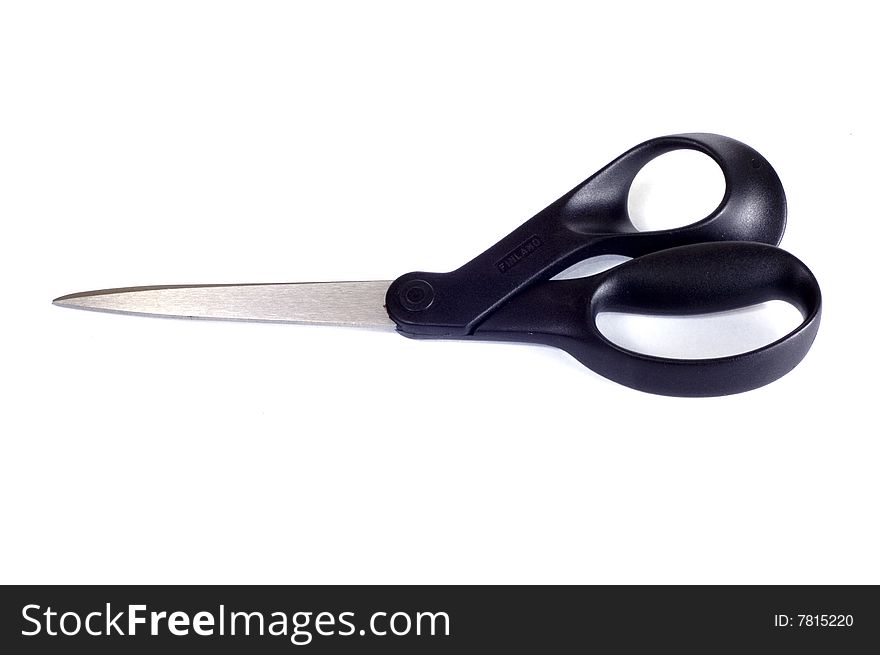 Black scissors on white background