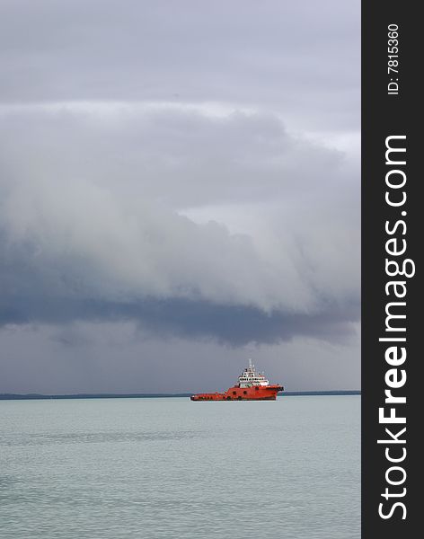 Tug boat heading out into a storm. Tug boat heading out into a storm.