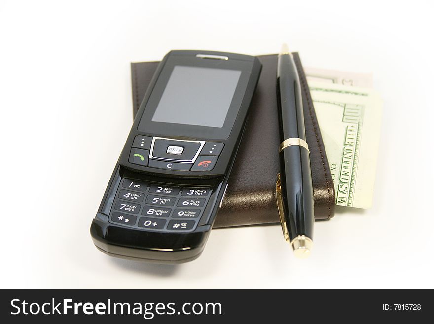 Phone and wallet with dollars isolated on white background. Phone and wallet with dollars isolated on white background