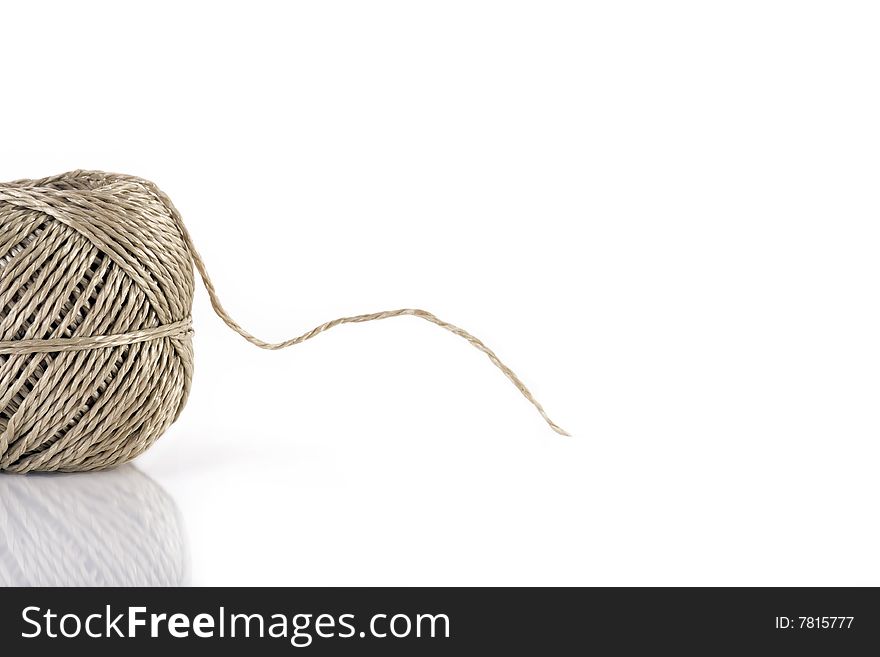 A ball of parcel string isolated on white