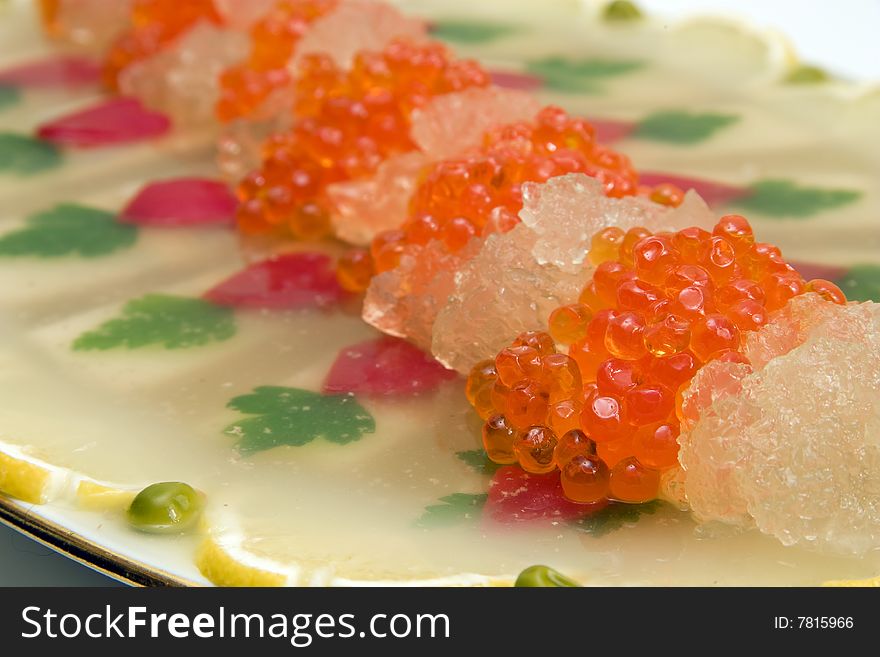 Appetizer from caviar and fish.