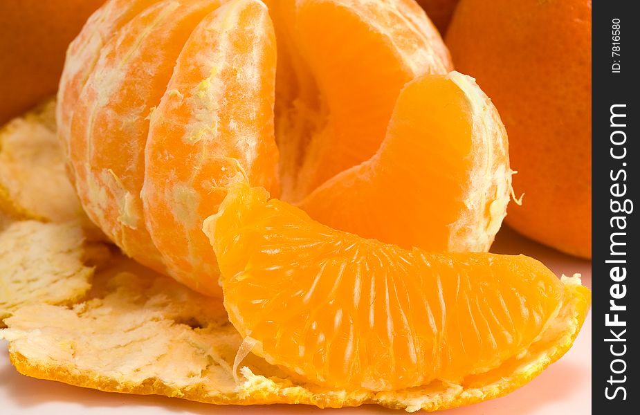 The cleared tangerine lies on a peel. The cleared tangerine lies on a peel