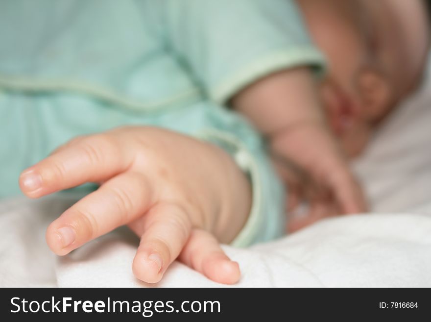 Fingers of the sleeping baby. Note: Slight blurriness.